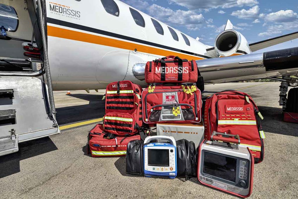 medical flight gear next to plane